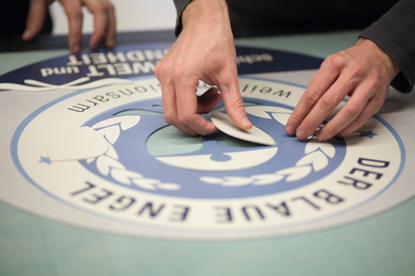 Creación de un logotipo como incrustación de suelo en el centro de incrustaciones nora